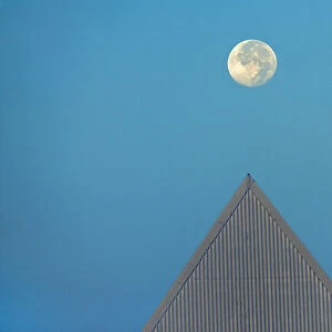 Canada, Ontario, St. Catharines. Full moon and triangular-shaped roof at Brock University