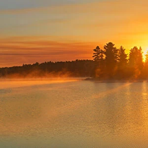 Canada, Ontario, Sunrise on Kakabikitchewan Lake. Credit as