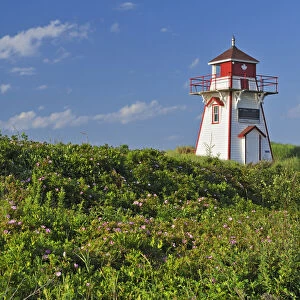 Canada, Prince Edward Island, Covehead Harbour. Lighthouse and flowers