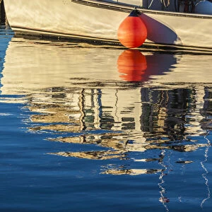 Canada, Prince Edward Island, Malpeque. Fishing boat reflection