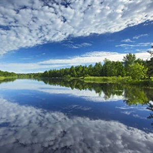 Canada, Quebec, Latulipe. Cloud reflection on Riviere Fraser