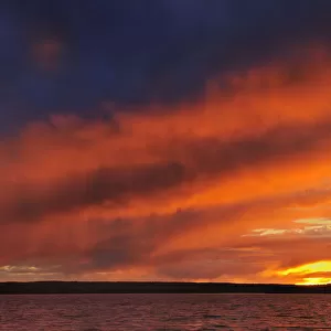 Canada, Saskatchewan, Prince Albert National Park. Storm on Waskesiu Lake at sunset