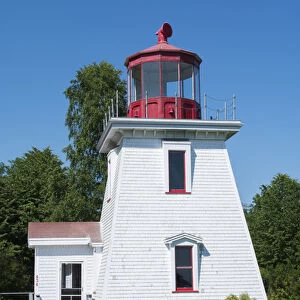 Canada St Martins New Brunswick white tourist lighthouse in small fishing and lobster