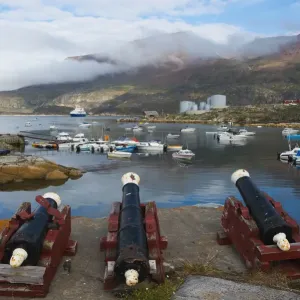 Cannon artillery overlooking the harbor, Qeqertarsuaq, Greenland Cannon artillery overlooking the harbor, Qeqertarsuaq, Greenland