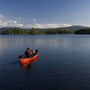 Canoeing on Prong Pond near Moosehead Lake in Maine USA (MR)
