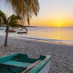 Caribbean Sunset Print featuring a wooden fishing boat on Grand Anse Beach Caribbean Sunset Print featuring a wooden fishing boat on Grand Anse Beach