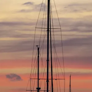 Caribbean, Grenada, Saint Vincent. Sailboat mast at sunset