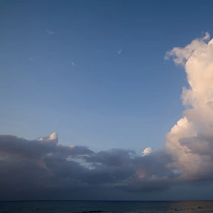Cayman Islands, Little Cayman Island, Sunset lights clouds above Caribbean Sea