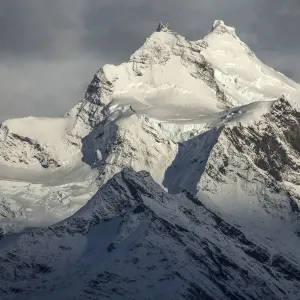 Chile, Patagonia. Snow-covered mountain peaks in sunlight