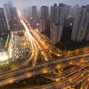 China, Chongqing, High angle view of traffic on massive expressways surrounded by
