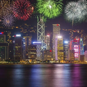 China, Hong Kong. Fireworks over city at night