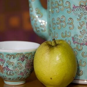 China, Hong Kong. Traditional Chinese teapot & cup with Chinese pear