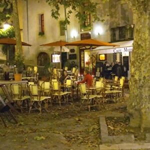 A city square with cafes and restaurants at night. Montpellier. Languedoc. France
