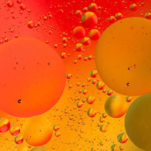 Close-up pattern of bubbles in oil and water mixture