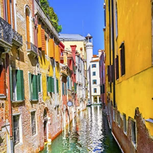 Colorful small canal building reflection, Venice, Italy