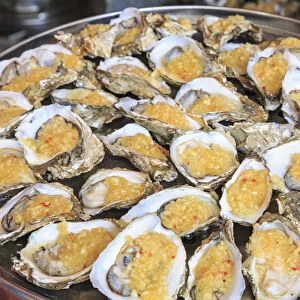 cooked oysters on a platter, shops around Nine Pedestrian Street, Guangzhou, China