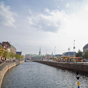 Copenhagen, Denmark - A canal running through an old world city. Horizontal shot