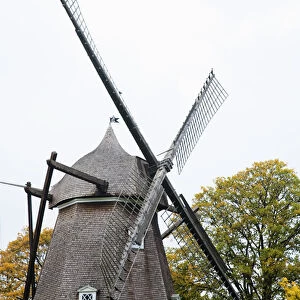 Copenhagen, Denmark - A historic old style windmill after having been restored. Vertical