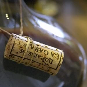 The cork tied in a sting around the neck of the decanter. Domaine de la Garance. Pezenas region