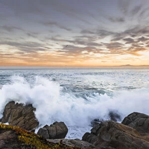 Crashing winter waves on the rocks of Lovers Point in Pacific Grove