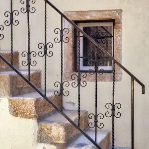 Croatia, Rovinj, Istria. Stairs and wrought iron railing leading to a home