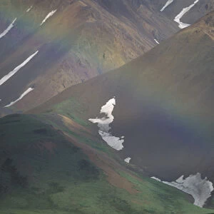 Denali National Park, AK. A rainbow set against the mountains