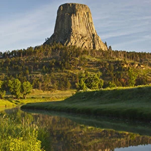 Devils Tower National Monument, Wyoming, reflected in Belle Fourche River at sunrise