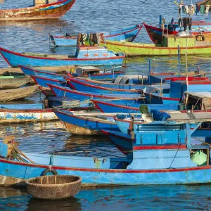 Distinctive red and blue fishing fleet in major fishing port of Nha Trang