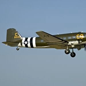 Douglass DC-3 / C-47 C-8 with D-Day Invasion Stripes in the sky