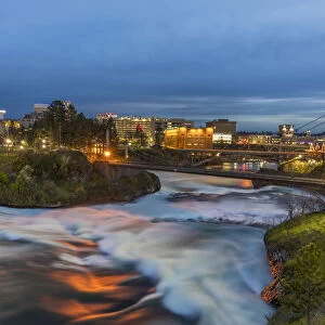Dusk descends over Spokane Falls in Spokane, Washington, USA