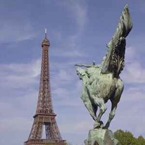 The Eiffel Tower in Paris with a statue of a horse seen from behind in the foreground