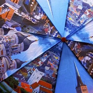 Estonia, Tallinn. Open umbrella showing city scenes in Tallinn