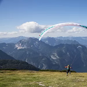 Europe, Austria, Dachstein, Paragliders as they prepare to take off above Lake Hallstatt