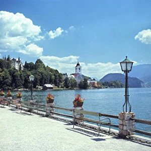 Europe, Austria, St. Wolfgang. The sun brightens the promenade at St. Wolfgang in the Salzkammergut