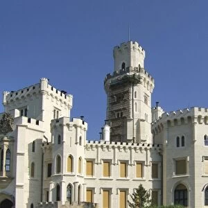 Europe, Czech Republic, Hluboka Castle. Workers repair the main tower at Hluboka