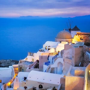 Europe, Greece, Santorini, Oia. Sunset on coastal town