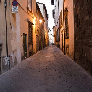 Europe; Italy; Lucca; Back Alley as evening Lights come