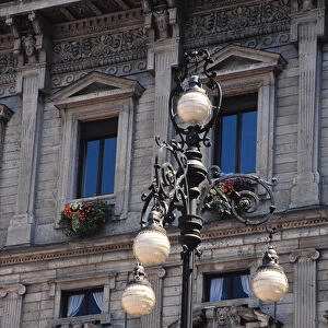 Europe, Italy, Milan. Lanpost, windows and flower boxes in Milan