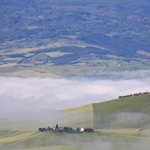 Europe; Italy; Tuscany; Pienza; Villa with Wheat Fields in Fog