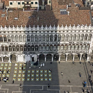 Europe, Italy, Venice. Campanile casts shadow over tile rooftops around Piazza San Marco