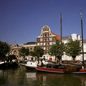 Europe, Netherlands, Dordrecht. Boats lining canal