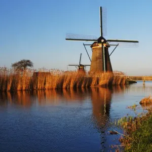 Europe; Netherlands; Kinderdijk; Evening Light along the canal with Windmills Europe; Netherlands; Kinderdijk; Evening Light along the canal with Windmills