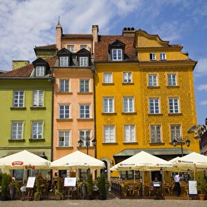 Europe, Poland, Warsaw. Buildings and outdoor dining in plaza