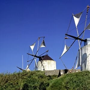 Europe, Portugal, Leiria. Windmills dot the countryside in the Leiria District, Portugal