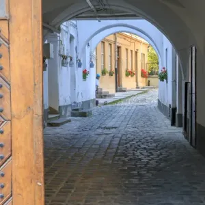 Europe, Romania, Brasov, cobblestone, narrow passage way, alleyway