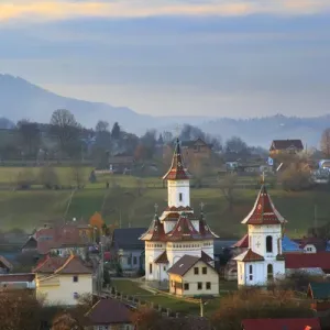 Europe, Romania, Bucovina, Campulung Moldovenesc, Fall colors. Churches in valley