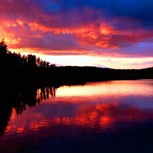 Fiery Sunset reflections in the boundry waters of Minnesota-Ontario