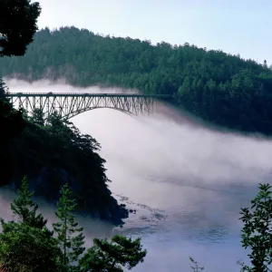 Fog drifts under the Deception Pass bridge at Deception Pass State Park