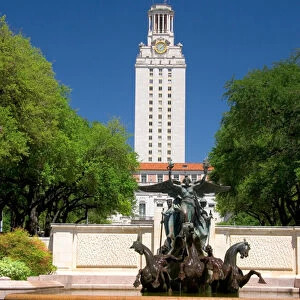 A fountain on the campus of University of Texas in Austin with the clock tower in