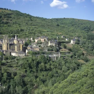 France: Conques, scenic view of Benedictine Abbey Church of Sainte-Foy and town nestled